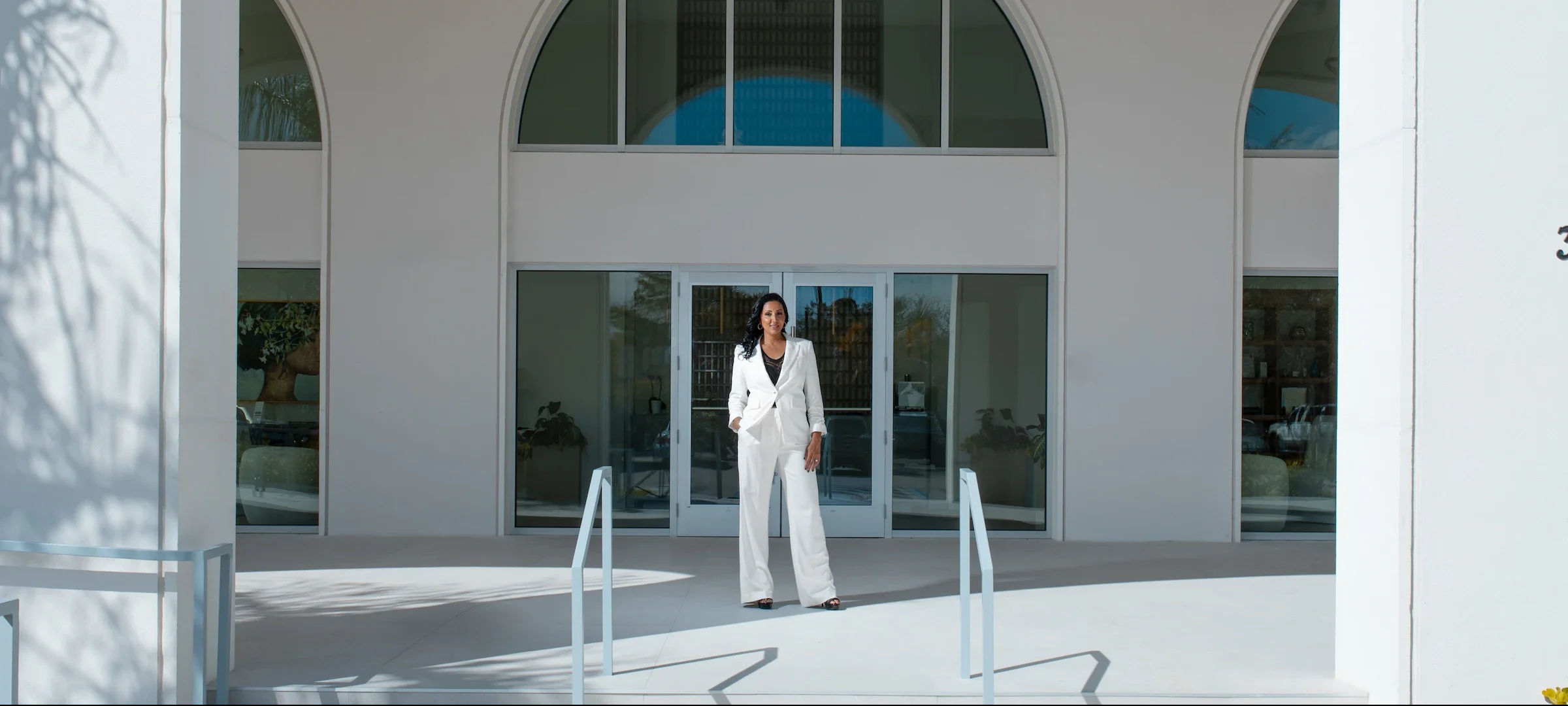 Dr. Gill standing in front of office building