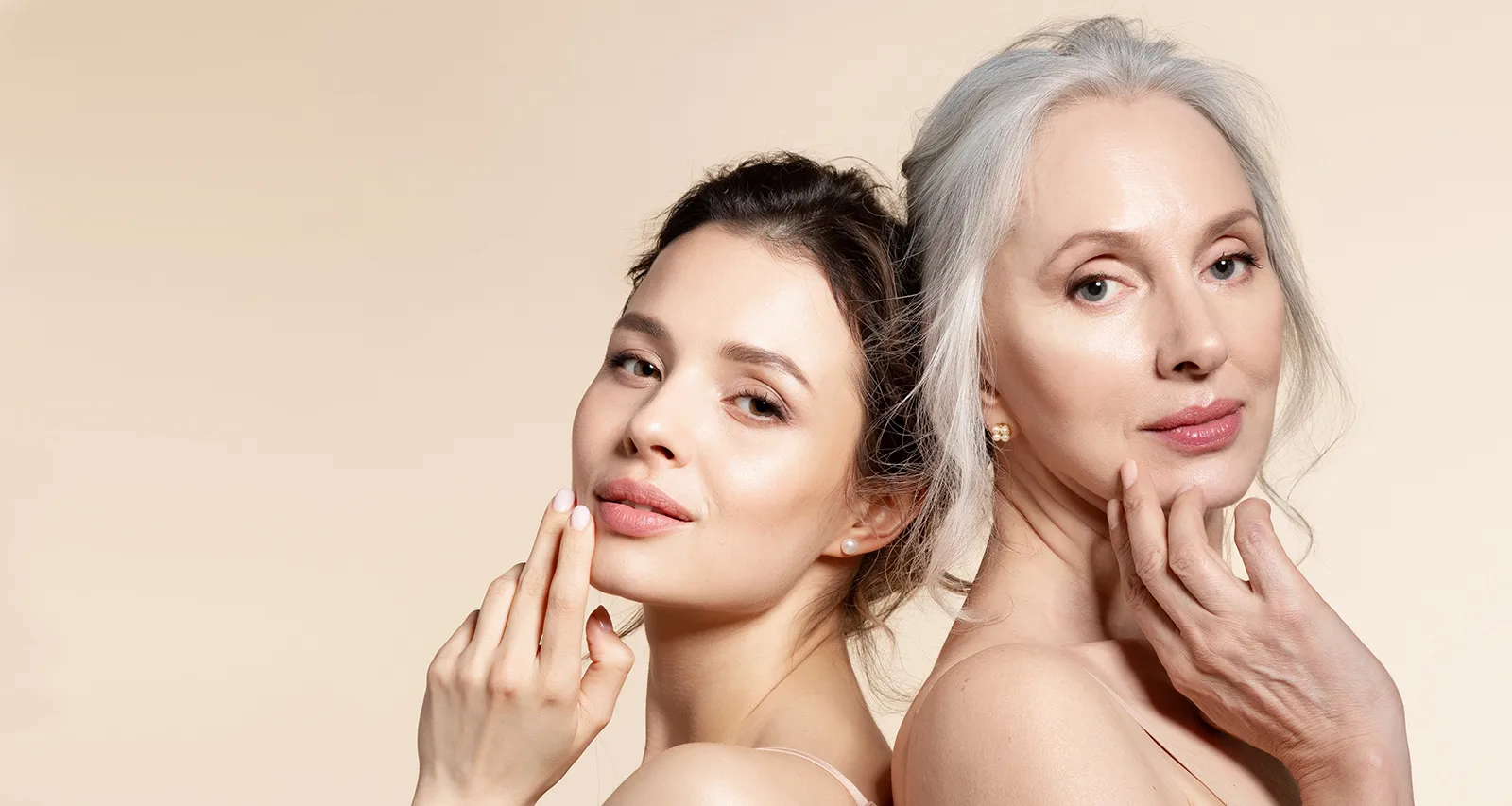 Young woman and senior woman posing together